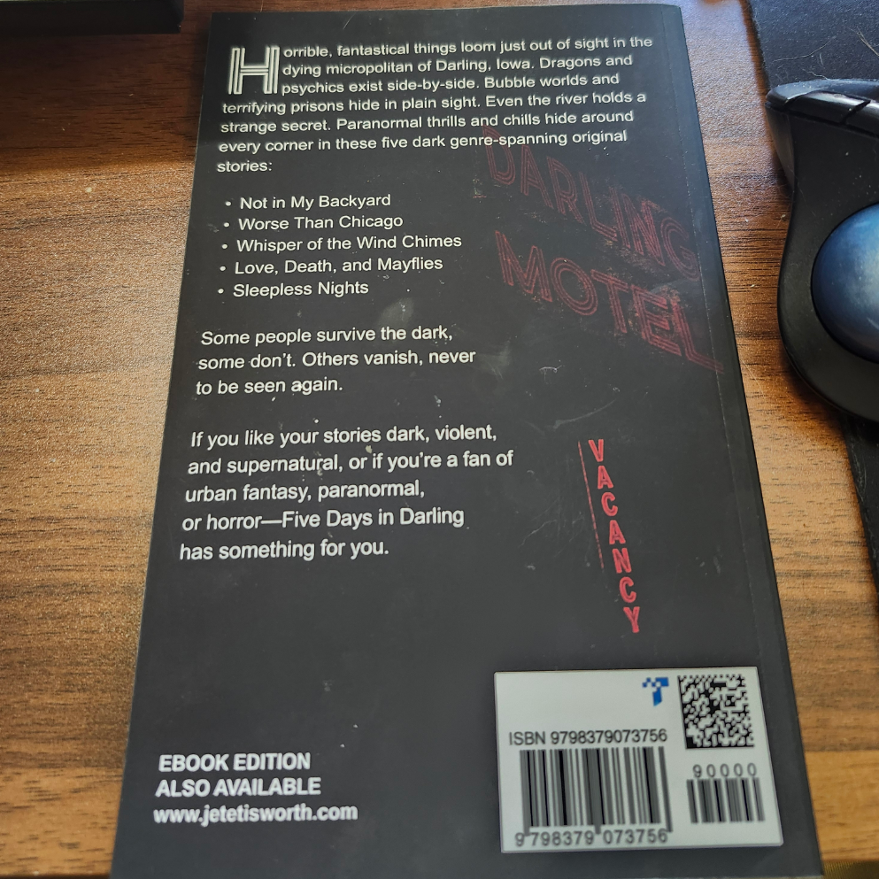 Back cover of a the book Five Days in Darling by author JE Teitsworth with text and branding on a wooden surface